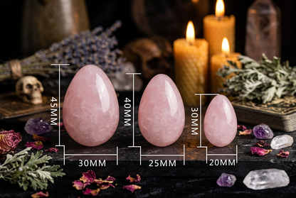 Three pink stones with measurements on a white background