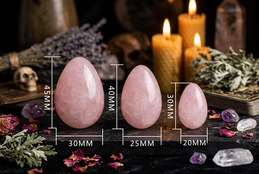 Three pink stones with measurements on a white background