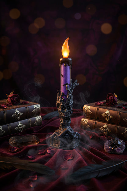 A Halloween-style decorative candle with a purple body, black wax-like top and base, and an orange flame-shaped bulb, shown on a plain white background.