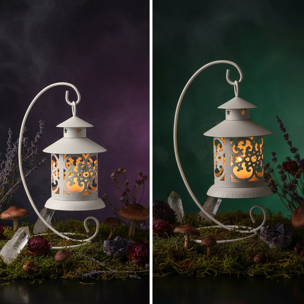 Decorative white lantern with intricate cut-out designs on a blue background, and another one illuminated in a warm glow.