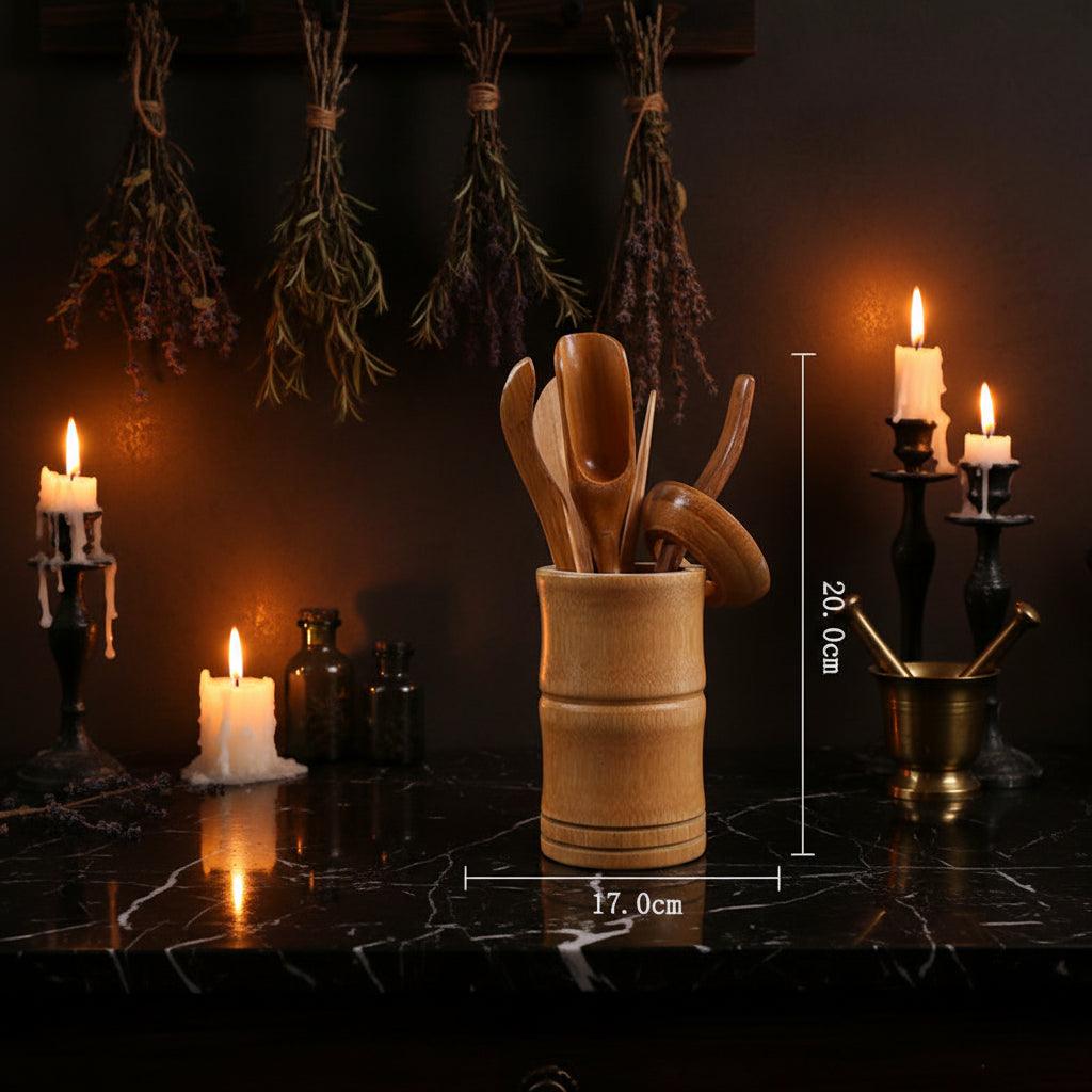 A set of wooden tea utensils, including a scoop, spoon, and lid, stored in a bamboo holder, with dimension lines indicating a height of 20.0 cm and width of 17.