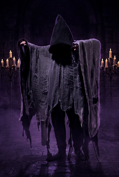 Person wearing a ghost costume with a white sheet draped over them against a plain background