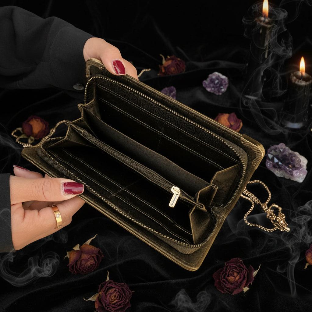 Black wallet held open by a hand on a textured surface