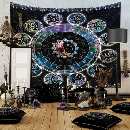 A black astrology zodiac tapestry with colorful circular astrological symbols and a central yin-yang motif, displayed on a wall in a room setting with a wooden floor, a black floor lamp, and decorative vases.