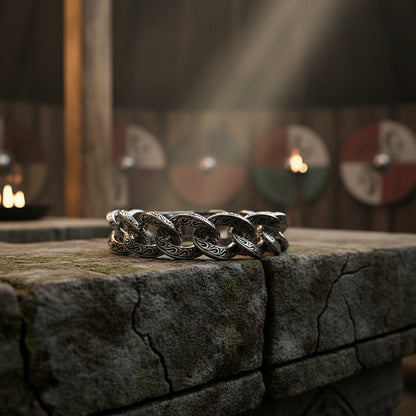 Silver chain bracelet on a dark background