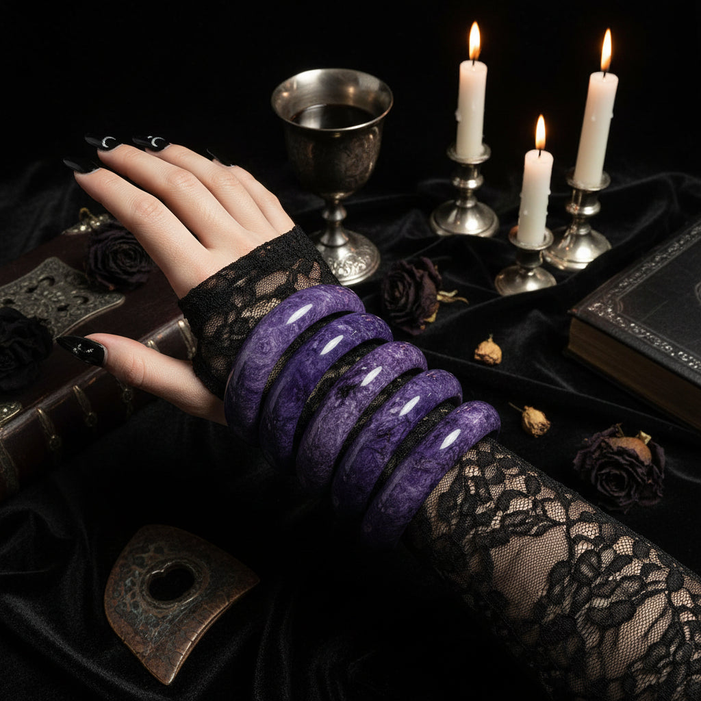Purple bracelets on a white surface with a remote control in the background